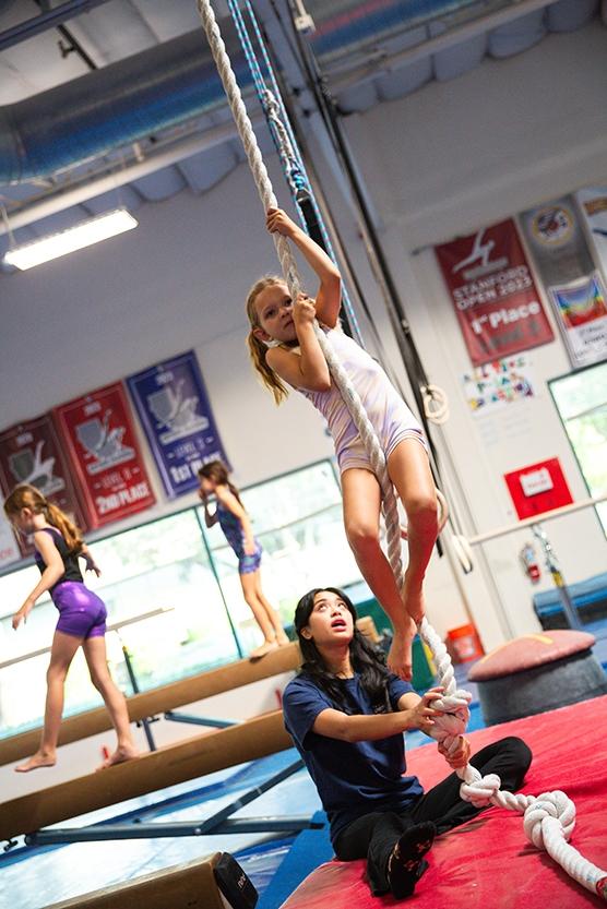 girl climbing rope